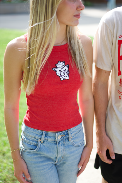 Person wearing Houston red tank top, graphic design, cougar head, standing outdoors.