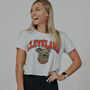 This model is wearing our ash crop top featuring our Cleveland Dawg design.