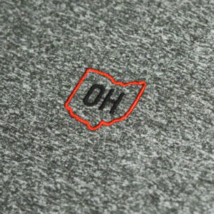 This enlarged image displayed the embroidered "OH" letters inside of the outline of the shape of the State of Ohio.